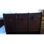 An early 20thC beech and canvas bound cabin trunk with straight sides and a hinged lid 19''h