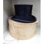 A Dunn & Co black silk top hat 21'' circumference,