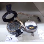 A World War II TG & Co London black painted brass cased compass, model no.