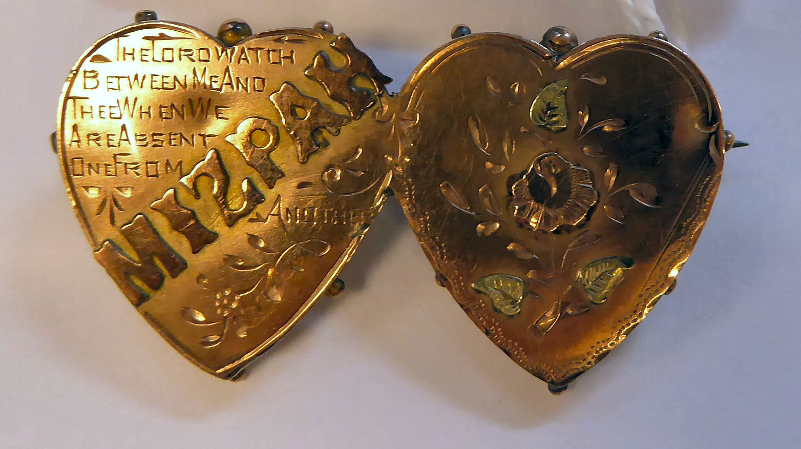 A Victorian 9ct bi-coloured gold double heart 'Mizpah' brooch 11
