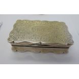 A Georgian style silver snuff box with a serpentine outlined border,