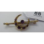 A 9ct gold crescent brooch,