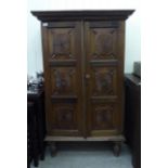 A modern Oriental carved hardwood cupboard,