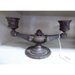 A late 19thC cast and patinated bronze table candlestand, featuring a lamp style base,