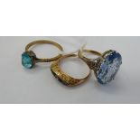 Three similar yellow metal rings,