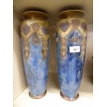 A pair of Art Nouveau period Royal Doulton Lambeth stoneware vases of tapered baluster form,