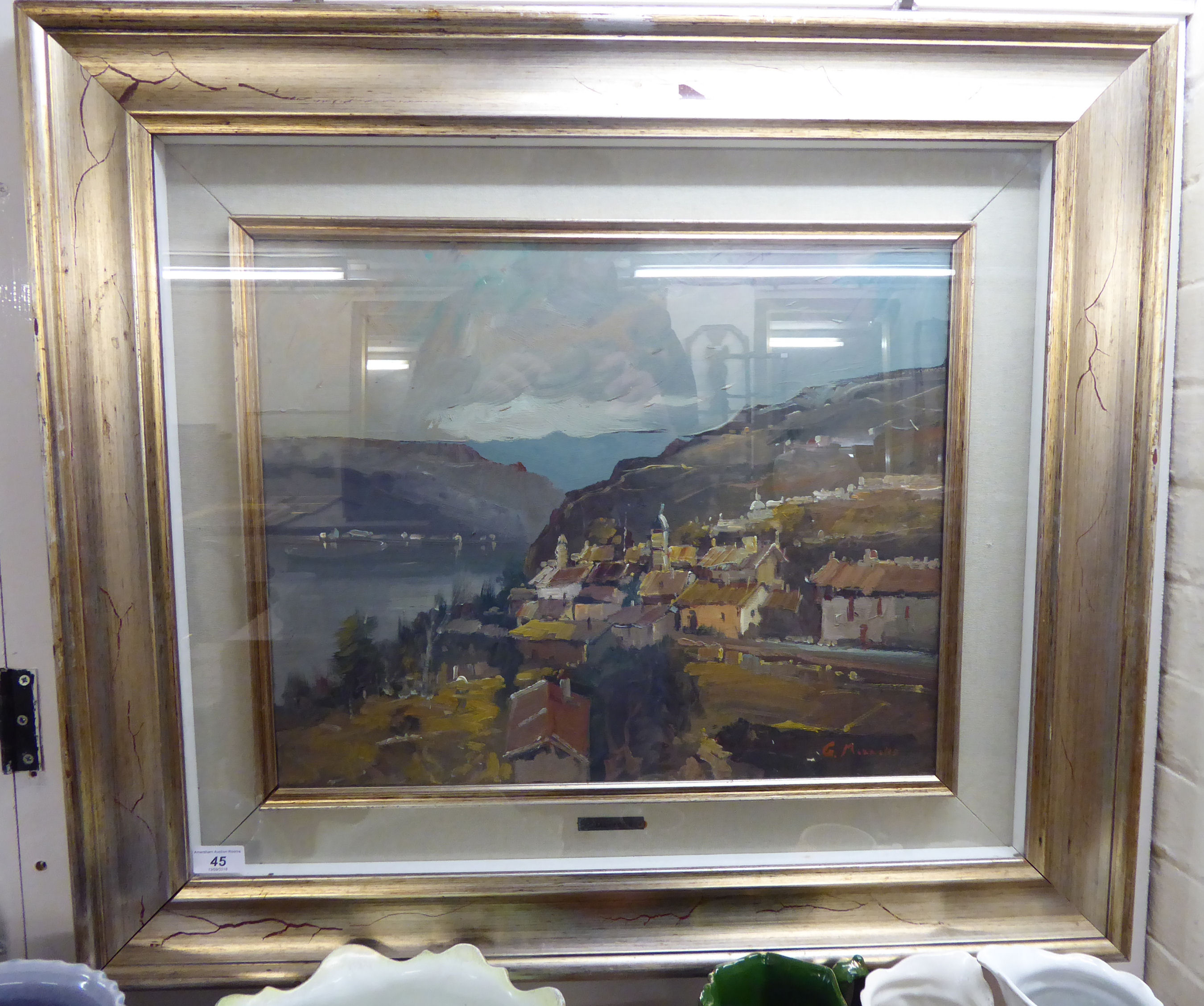 G Morrone - a shoreline scene with a village and mountains beyond oil on canvas bears a signature