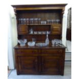 A modern reproduction of an Old English oak dresser,