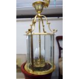 A modern Georgian style brass framed hanging lantern light with bevelled glass panels and