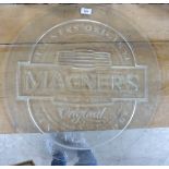 A clear coated glass promotional advertising sign for 'Magners Irish Cider' 23''dia BSR