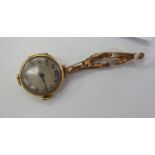 A lady's 9ct gold cased wristwatch, faced by an Arabic dial,