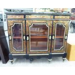 A 20thC reproduction of a Victorian breakfront display cabinet with a mottled marble top and
