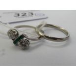 A platinum wedding ring and other white metal rings,