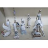 Lladro and Nao porcelain figures: to include a young Japanese woman arranging flowers 8''h