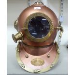 A reproduction of an early 20thC copper and brass Navy diver's helmet TO9