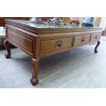 A 20thC Chinese exotic hardwood coffee table with six frieze drawers,