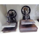 Two similar early 20thC Wilcox & Gibbs cast iron manual sewing machines OS5