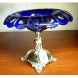 An early 20thC table centrepiece with a clear and blue Bohemian glass bowl,