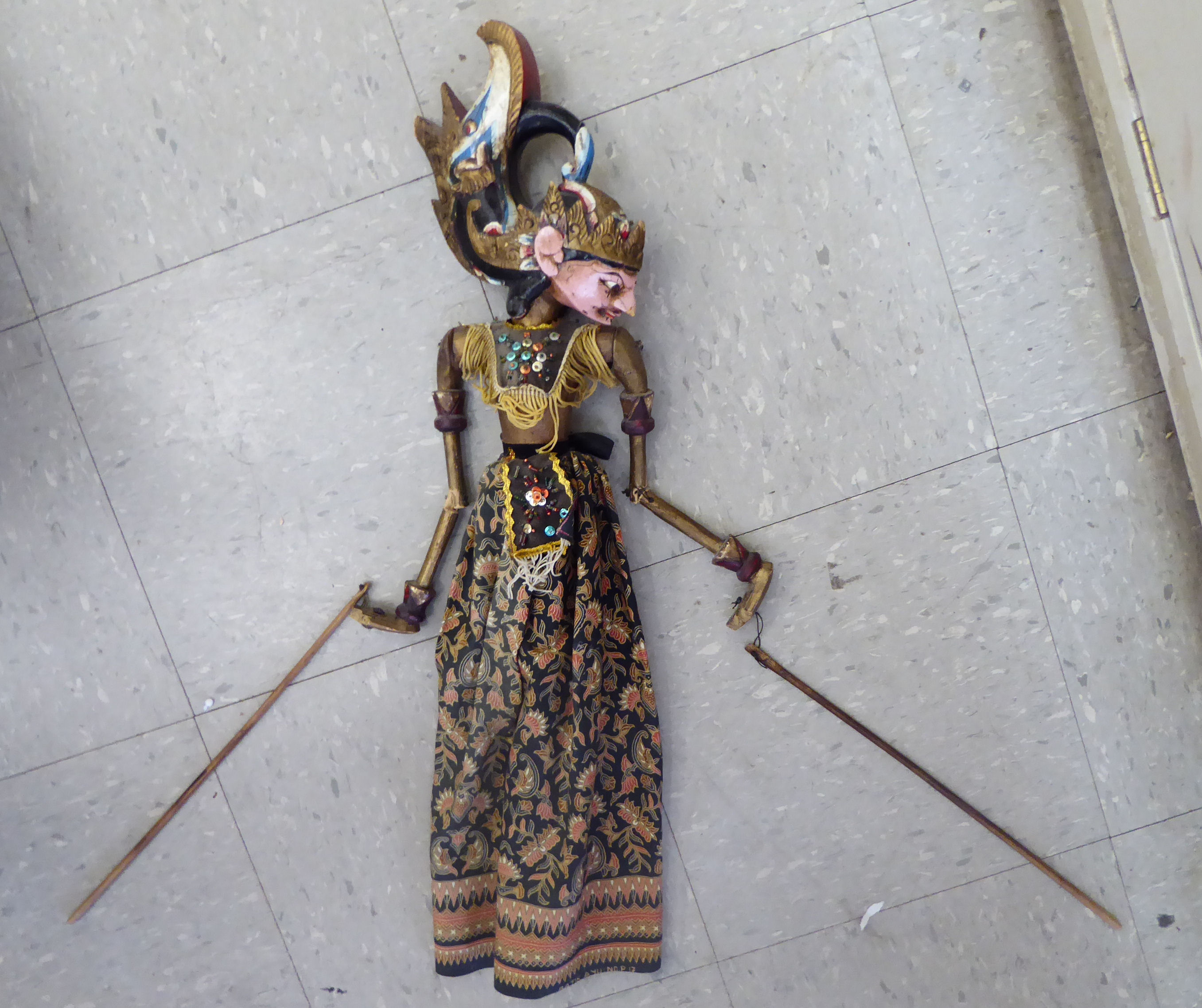 A 20thC Indonesian painted wooden puppet,