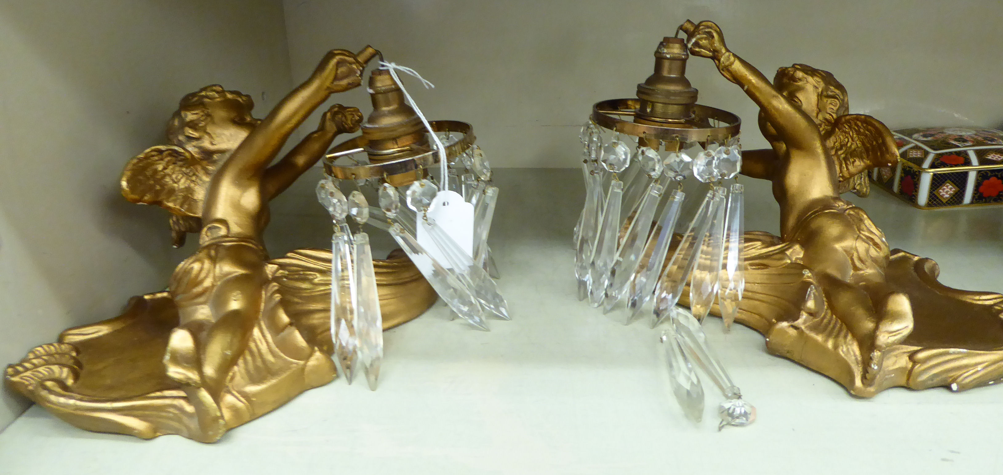 A pair of 20thC moulded and gilded plaster wall lights,