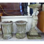 A pair of composition stone garden pedestal urns 19''h 16''dia;