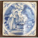 An 'antique' Dutch pottery tile, decorated in blue and white, in an oak frame 4.