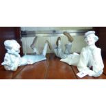 Two similar Lladro porcelain figures, reclining clowns,