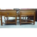 A pair of 20thC Chinese exotic hardwood lamp tables, each with a single drawer, over an open shelf,