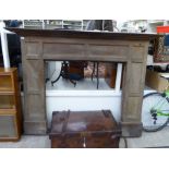 An early 20thC stained oak fire surround 62''h 82''w (inside measurement 46''L 46''w 55''deep)