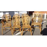 A set of six modern elm framed, hoop, spindle and splat back dining chairs,