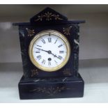A late Victorian black slate mantel clock;