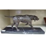 A 20thC cast spelter model, standing hound, on a rectangular marble plinth 8.