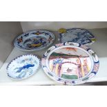 Four pieces of 18thC Dutch Delft earthenware: to include an Adriaan Pynacher, decorated with hills,