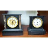 Two late Victorian black slate mantel clocks, one faced by a Roman dial,