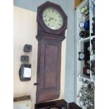 A late Victorian mahogany cased clock; the movement faced by a Roman dial inscribed JH Skarrah,