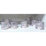 A matched set of six Continental silver coloured metal filigree cup holders bearing indistinct