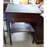 A late Victorian mahogany writing desk with a sloping hinged top and a frieze drawer,