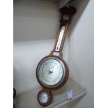 A modern American made mahogany finished cased barometer with a broken arch pediment,