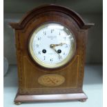 An Edwardian satinwood inlaid mahogany mantel clock;