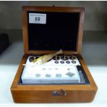 A set of 20thC brass chemical balance weights and accessories, in a mahogany fitted box 2.