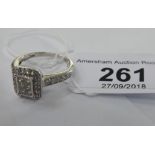 A 9ct white gold and diamond set ring 11