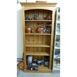 A modern waxed pine open front, five tier bookcase,