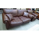 A modern three person settee, upholstered in stitched brown hide,