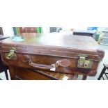 An early 20thC stitched brown hide suitcase with straight sides and a hinged lid 7''h 24''w