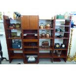 A modern Chinese teak modular living room unit, comprising an arrangement of open shelves,