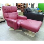 A G-Plan stitched cerise pink hide upholstered Oberon armchair;