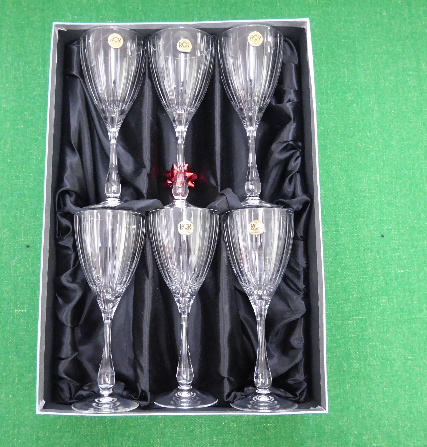 A set of six Italian rock crystal pedestal wine glasses with line-cut ornament boxed CA