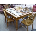 A modern chestnut farmhouse style dining table, the top with rounded corners,