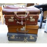 Four similar early 20thC stitched hide and other cases various sizes S