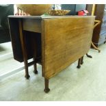 An early 20thC mahogany drop-leaf table, the top with canted corners, raised on square,